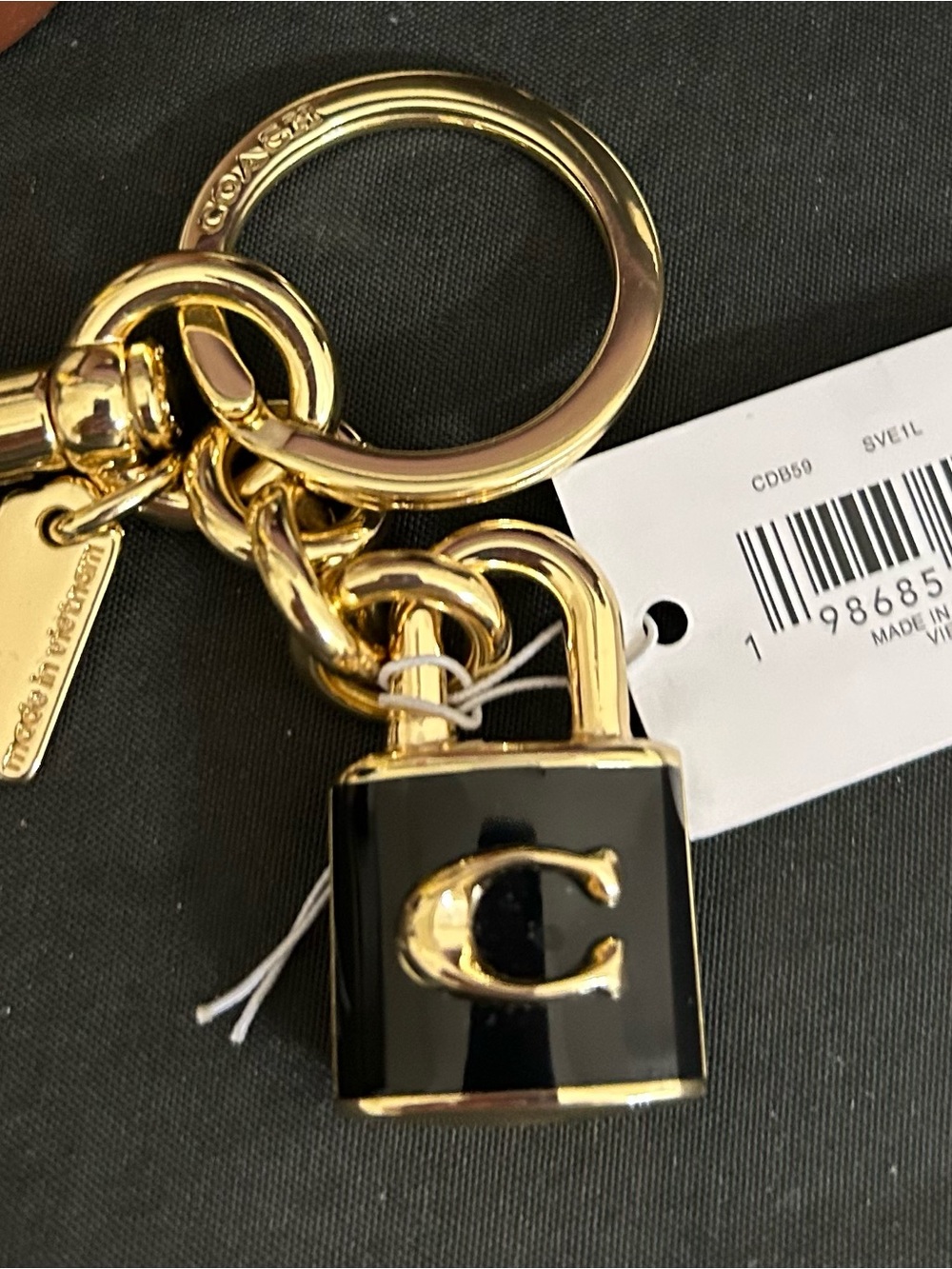 NWT Coach Keychain/Bagcharm Lock and Purple Coach Wristlets EUC with dustbag. - Picture 2 of 6